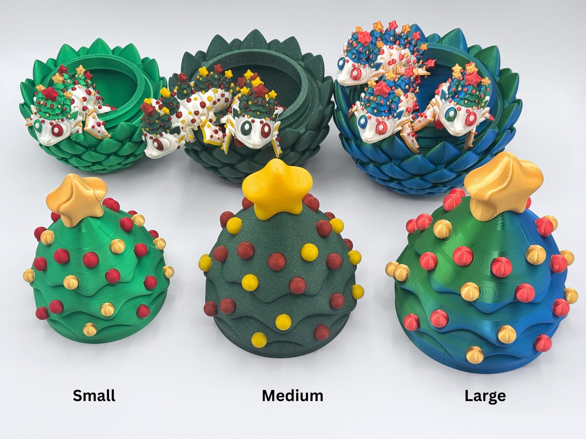 Three 3D printed Christmas tree dragon egg sets in small, medium, and large sizes, each displayed with the correct number of articulated Christmas dragons to show egg capacity: one, two, or three. White background for clear size comparison.